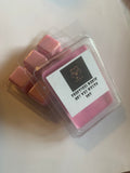 Practical Magic 3 ounce soy wax melts in a pink clamshell package