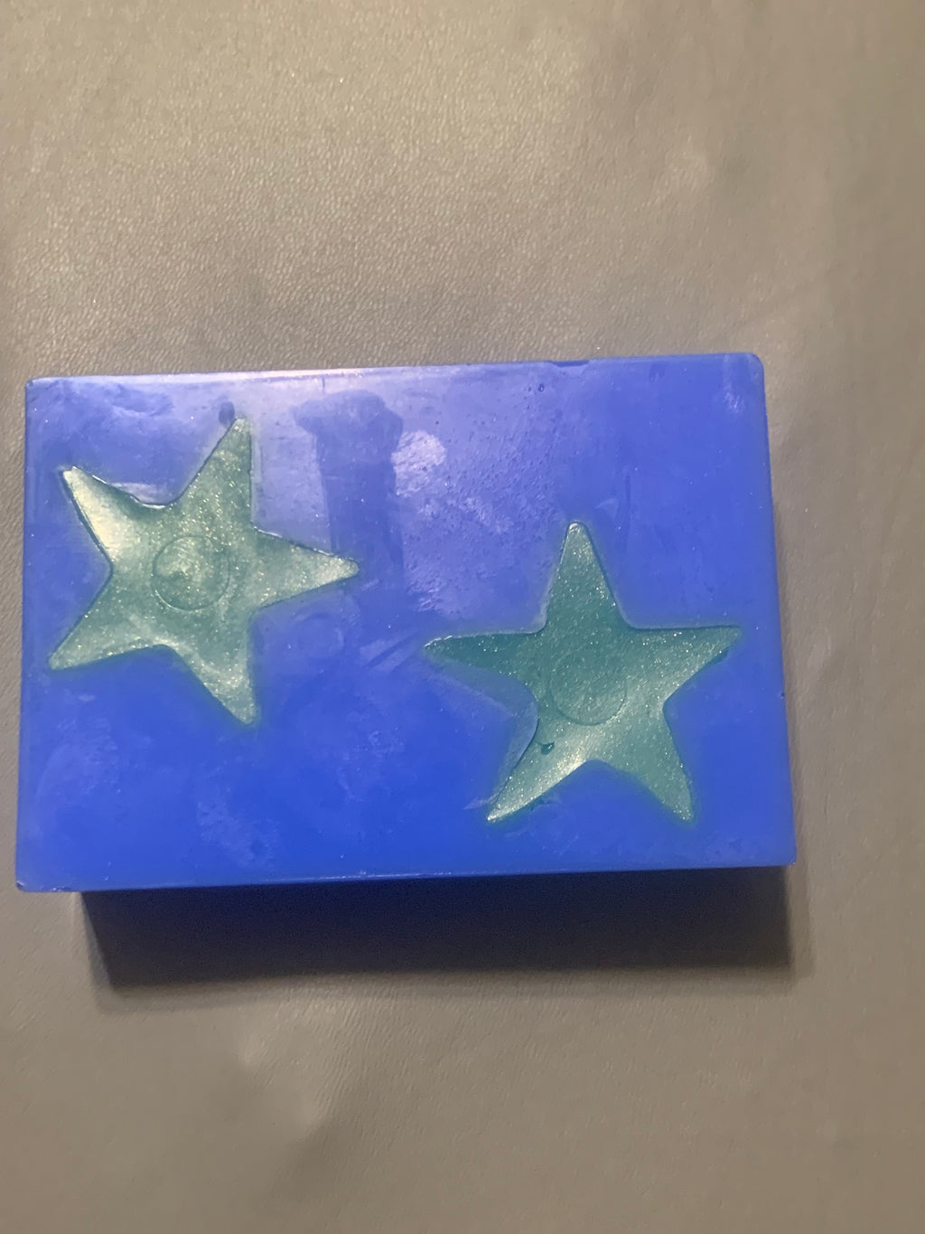 Blue Practical Magic goat milk soap bar with embedded stars