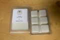 Jasmine soy wax melt clamshell with 6 white square cubes and Merry Bee Apothecary label