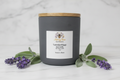 Lavender and sage spa candle in matte gray jar with bamboo lid and Merry Bee Apothecary label